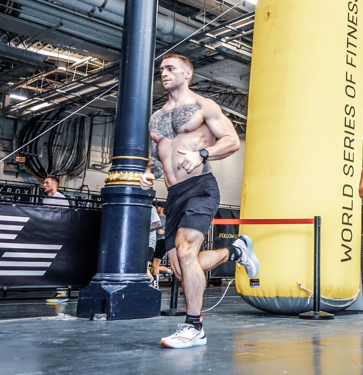 Rob running between stations at HYROX London